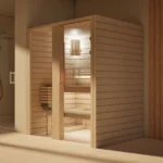 Sauna Amara Profilholz Linde mit Saunaofen im Badezimmer, Ansicht schräg von vorn